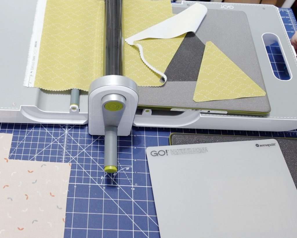 AccuQuilt fabric cutting machine for Triangle in a Square Quilt blocks