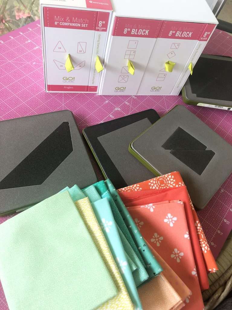 AccuQuilt fabric cutting machine compared to cricut maker