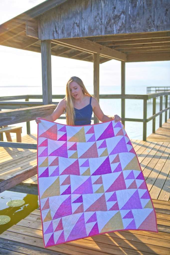 easy accuquilt quilt pattern featuring half square triangles