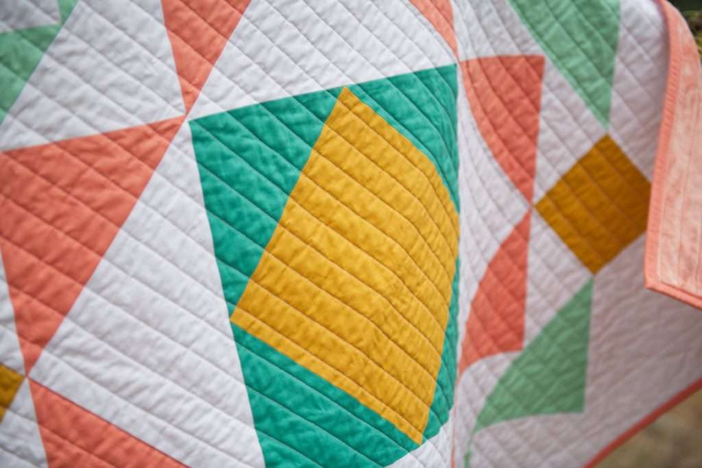 paradigm quilt pattern by homemade emily jabe is a great modern baby quilt pattern. If you're looking for a modern geometric quilt pattern that features modern quilt pattern design, the Paradigm quilt pattern is perfect for you! this modern flying geese quilt pattern features modern quilt blocks and is backed with minky fabric