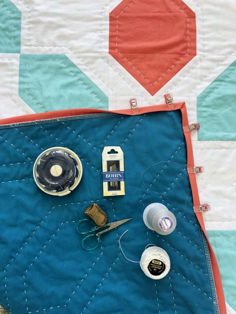 Learn how to hand sew your quilt binding onto your quilt