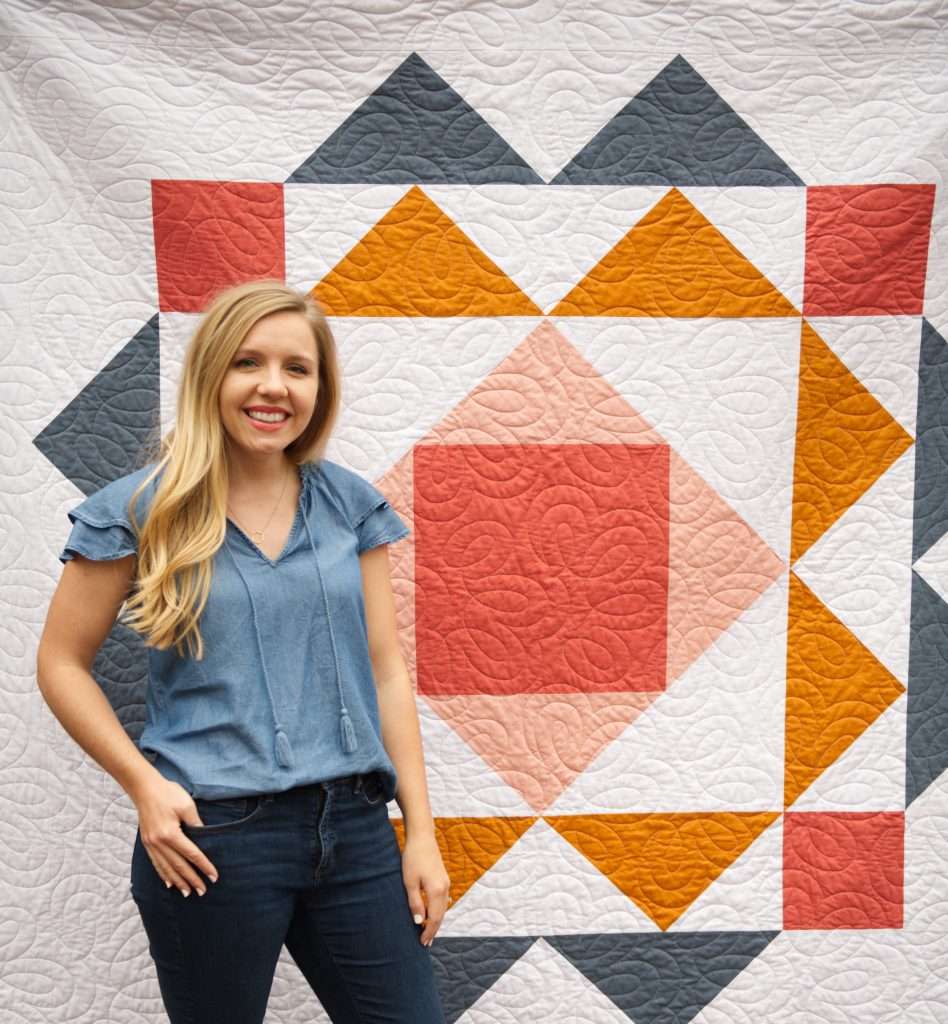 Modern geometric quilt pattern by Homemade Emily Jane, the paradigm quilt pattern features large flying geese quilt blocks and is a great way to show off quilting designs