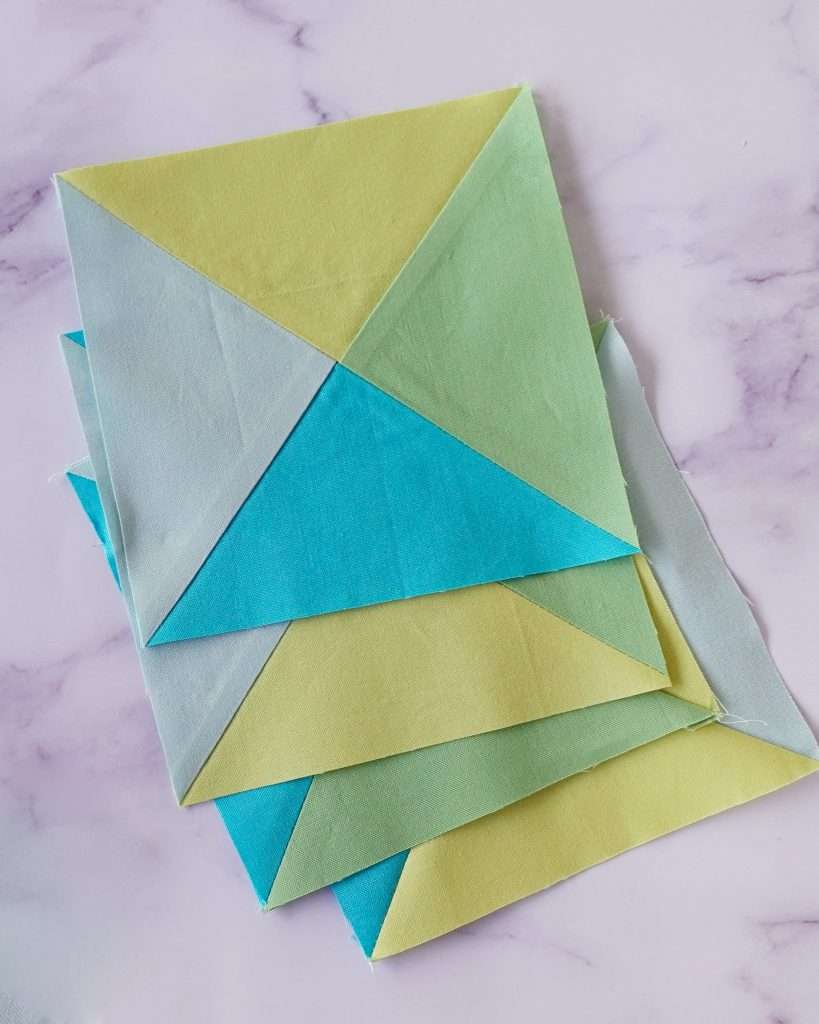 four hourglass quilt blocks