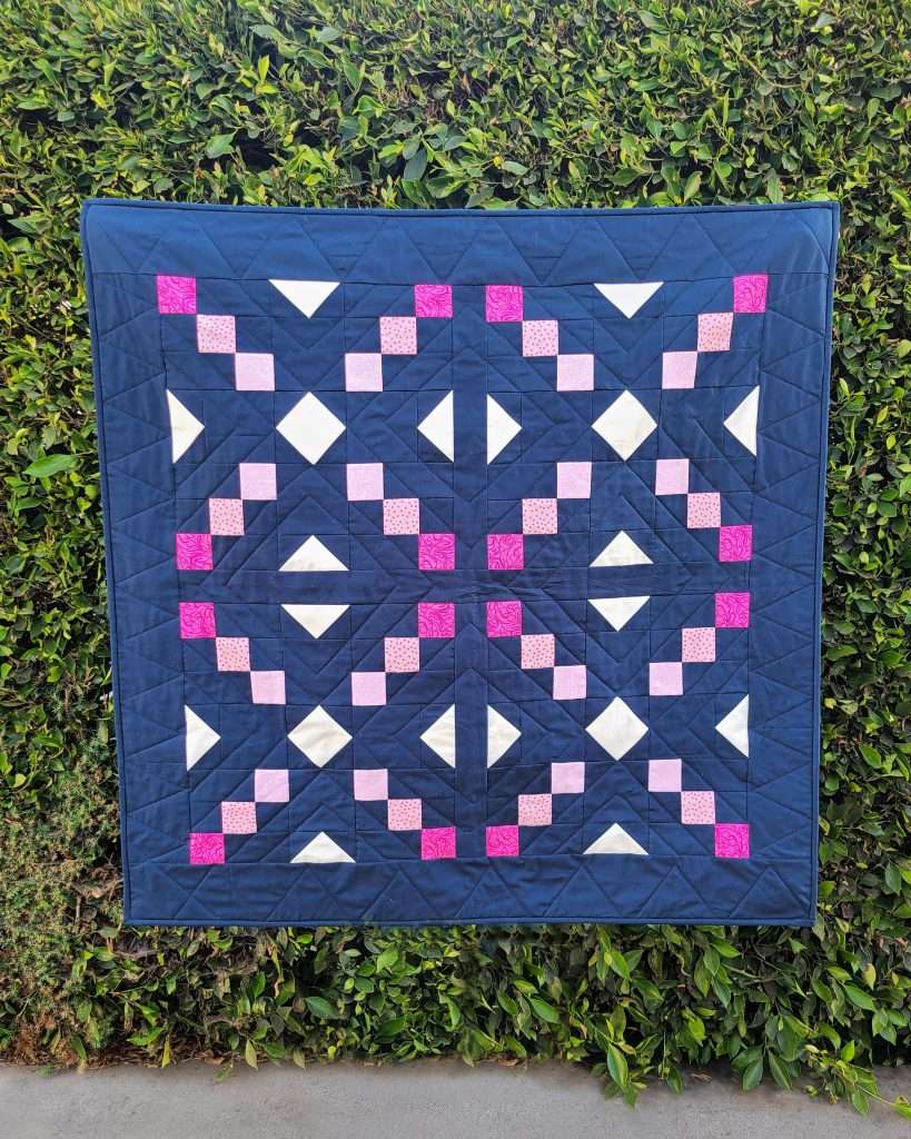 navy and pink baby quilt