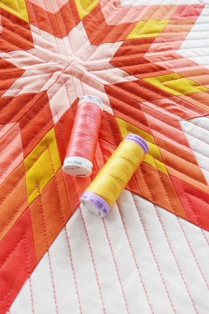 sewing threads to make a quilt block