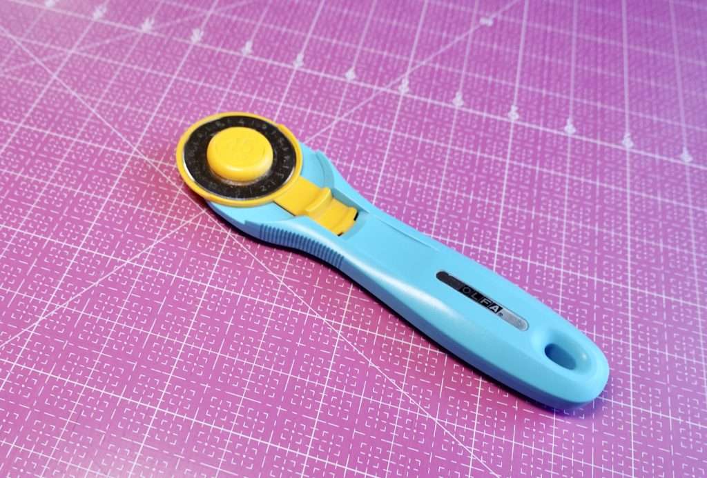 a rotary cutter is one of the essential quilting supplies you need to get started making a quilt