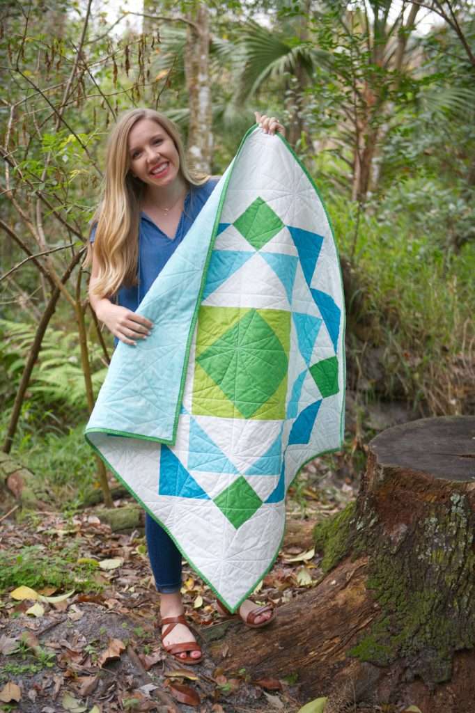 paradigm quilt pattern by homemade emily jabe is a great modern baby boy quilt pattern. If you're looking for an easy quilt pattern that features modern quilt pattern design, the Paradigm quilt pattern is perfect for you! this easy baby quilt was backed with minky fabric and is so cozy and cuddly!