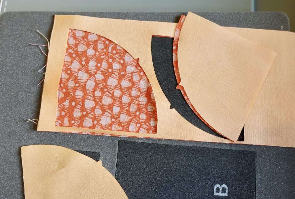 cutting out curves using AccuQuilt GO Fabric cutting machine drunkard's path die