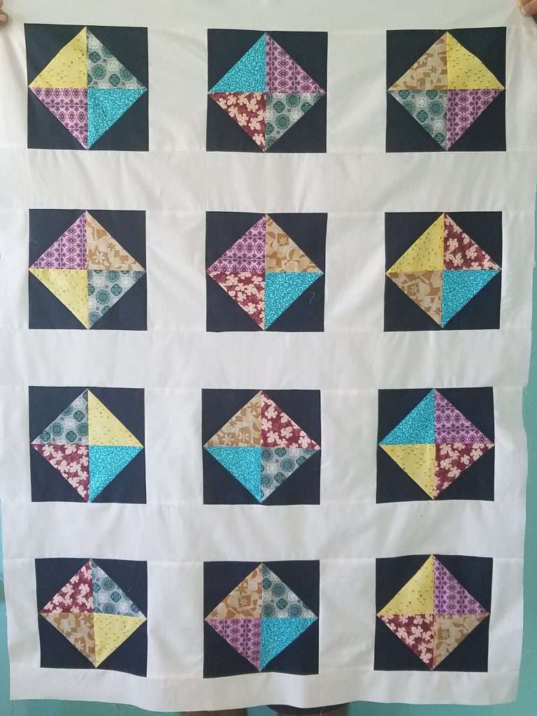 Brightly colored baby quilt easy beginner quilt pattern