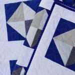 throw size solitaire quilt navy and white half square triangles