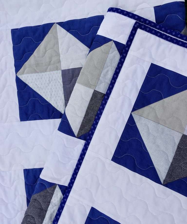 throw size solitaire quilt navy and white half square triangles