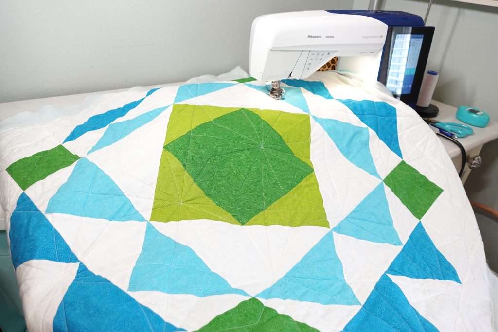 paradigm quilt pattern by homemade emily jabe is a great modern baby boy quilt pattern. If you're looking for an easy quilt pattern that features modern quilt pattern design, the Paradigm quilt pattern is perfect for you! this easy baby quilt was quilted with a fun geometric quilting design and backed with cozy minky fabric