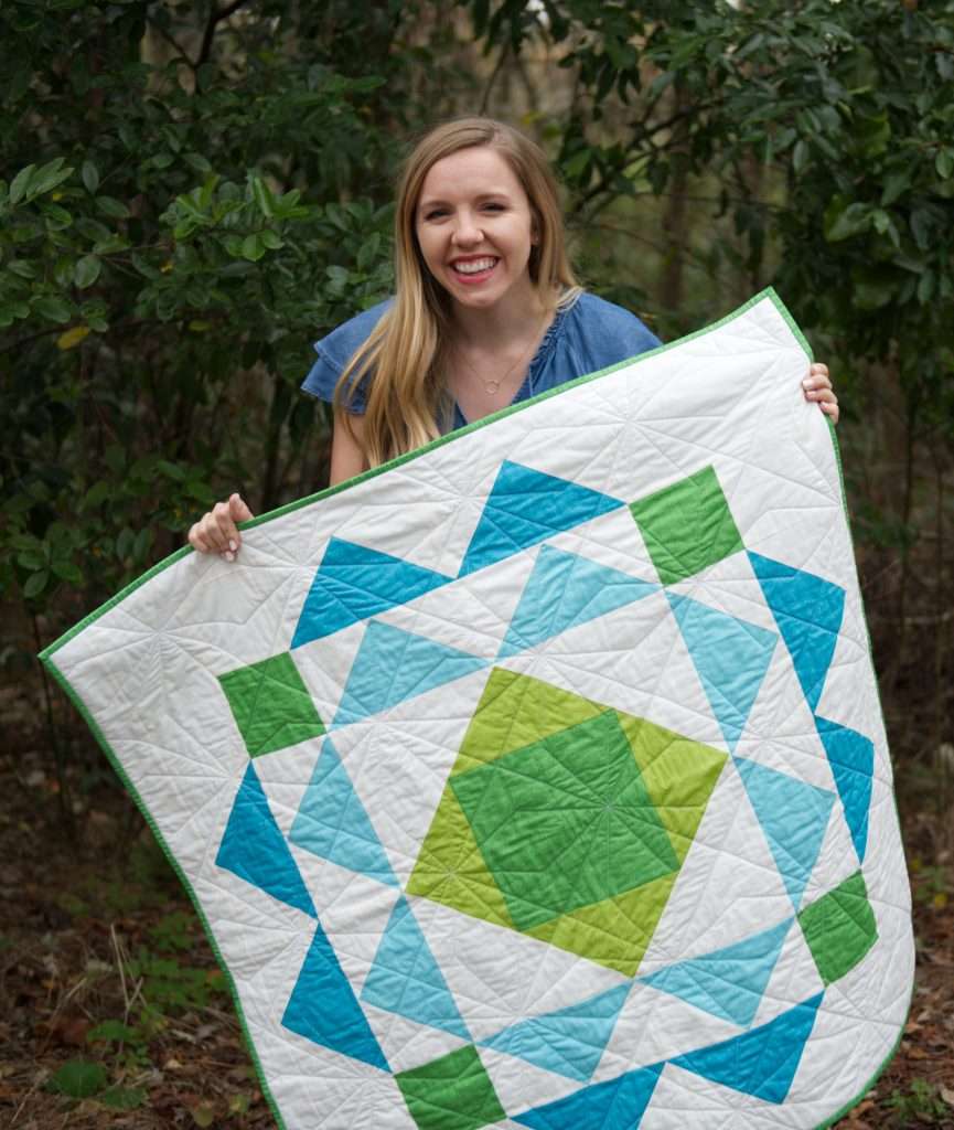 paradigm quilt pattern by homemade emily jabe is a great modern baby boy quilt pattern. If you're looking for an easy quilt pattern that features modern quilt pattern design, the Paradigm quilt pattern is perfect for you! this easy baby quilt was quilted with a fun geometric quilting design and backed with cozy minky fabric