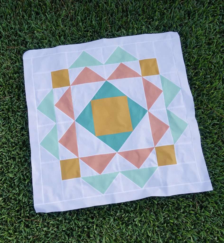 paradigm quilt pattern by homemade emily jabe is a great modern baby quilt pattern. If you're looking for a modern geometric quilt pattern that features modern quilt pattern design, the Paradigm quilt pattern is perfect for you! this modern flying geese quilt pattern features modern quilt blocks and is backed with minky fabric