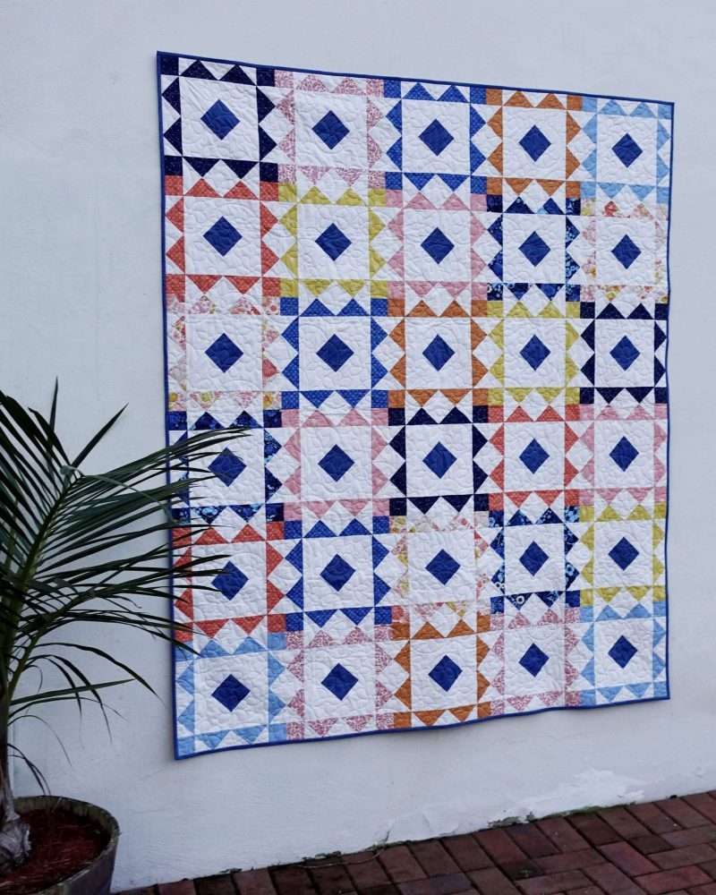 Reverberate modern quilt pattern, fat quarter quilt, brightly colored quilt, flying geese quilt, quilting tutorial, figo fabrics, prickly pear fabrics, fat quarter fabrics