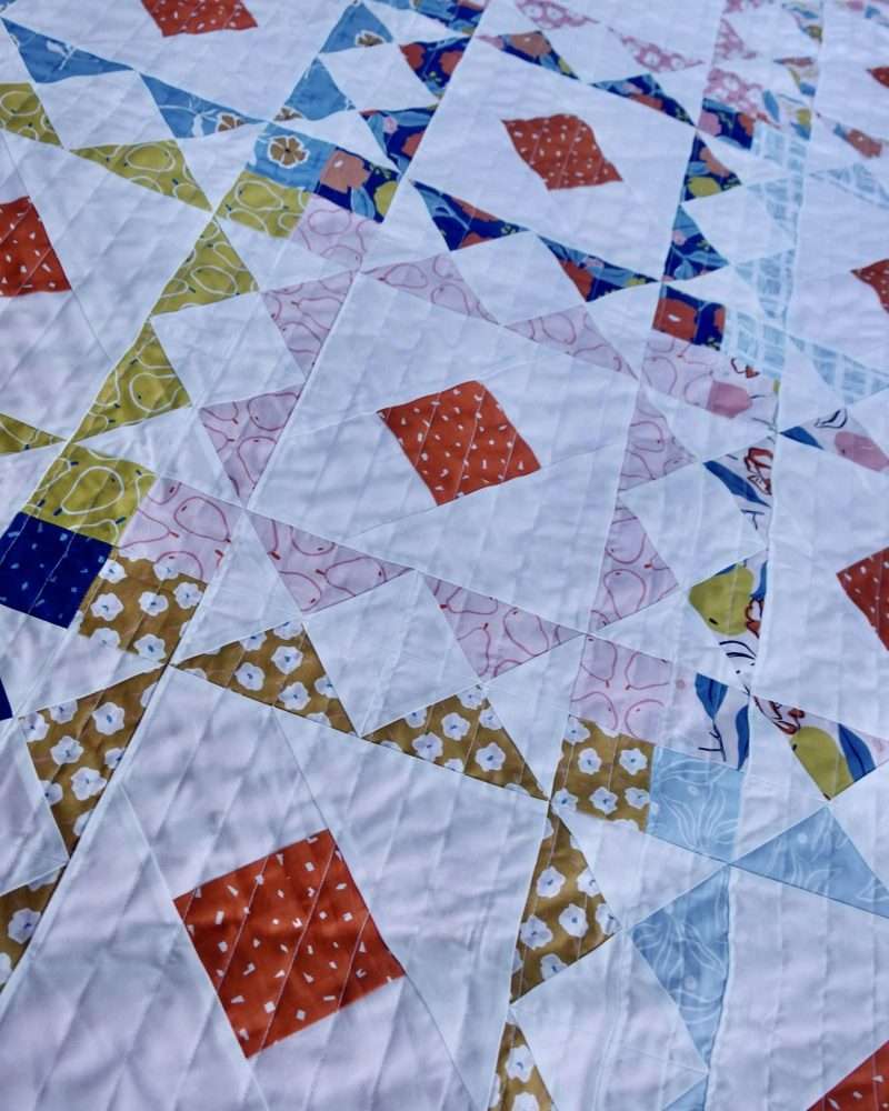 Reverberate modern quilt pattern, fat quarter quilt, brightly colored quilt, flying geese quilt, quilting tutorial, fat quarter fabrics, homemadeemilyjane