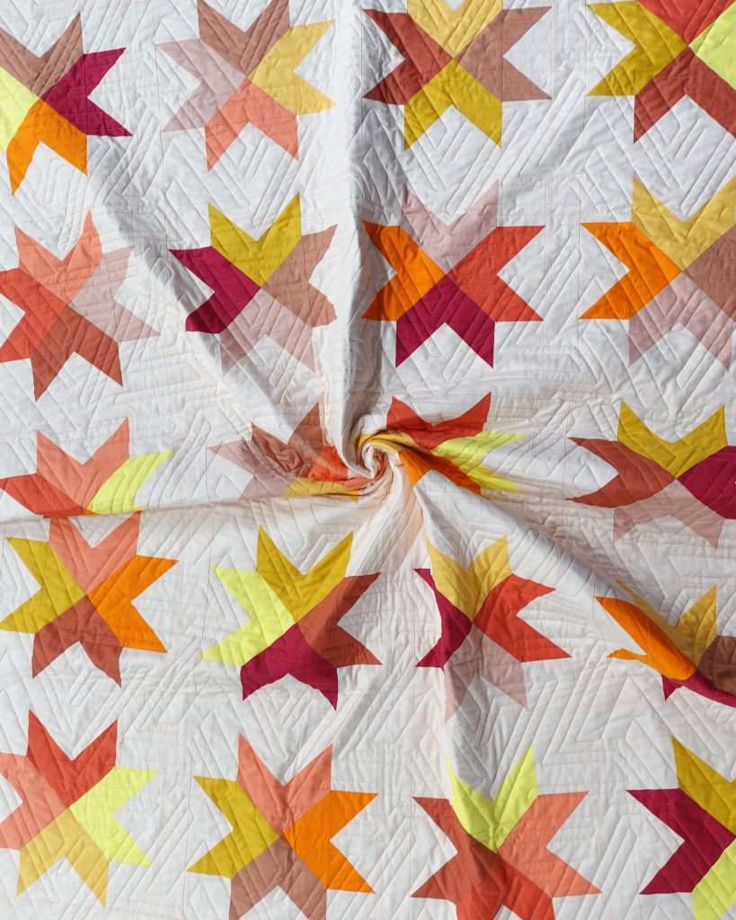 a modern quilt pattern featuring traditional techniques