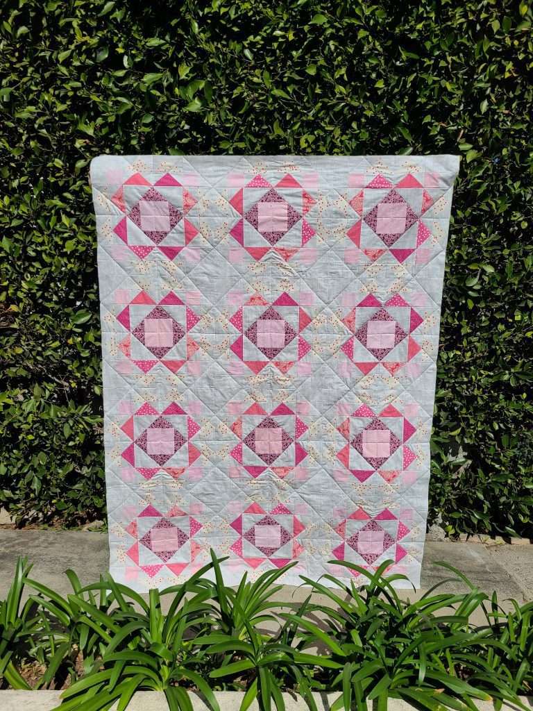 Sprightly quilt by Laura from sharingseams, throw size quilt turned into pink crib quilt